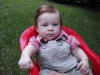 20020812-simon-pose-4-month-chair-red-out-03-600.jpg (81835 bytes)