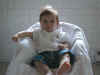 20020812-simon-pose-4-month-chair-white-in-2-600.jpg (58910 bytes)