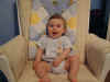 20020912-simon-pose-5-month-chair-02-600.jpg (79070 bytes)