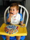 20030412-simon-bday-cake-26-eating-600.JPG (76682 bytes)