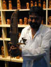 in-pow-uda-paint-shop-carving-man-600.jpg (77031 bytes)